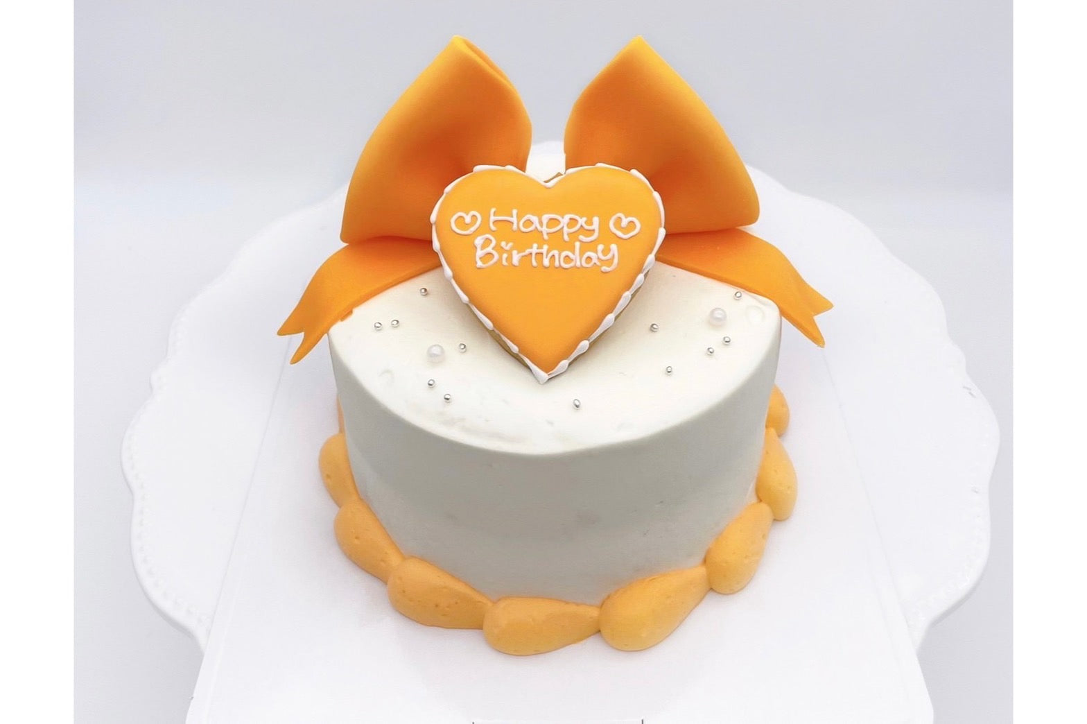 リボンケーキ（オレンジ） – 【オーダーケーキの通販・専⾨店】⼤阪
